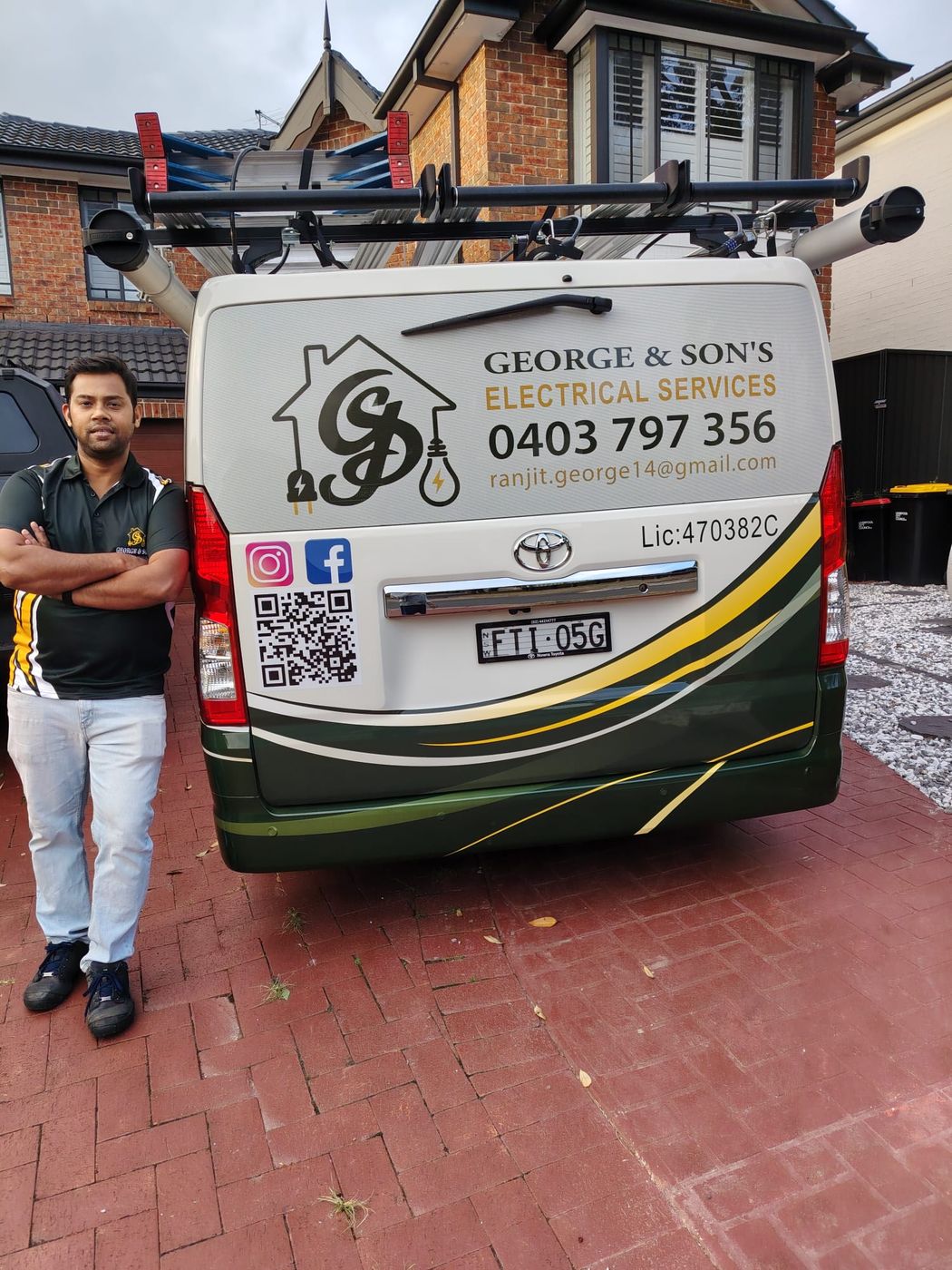 Ranjit George standing in front of his George & Son's Electrical van